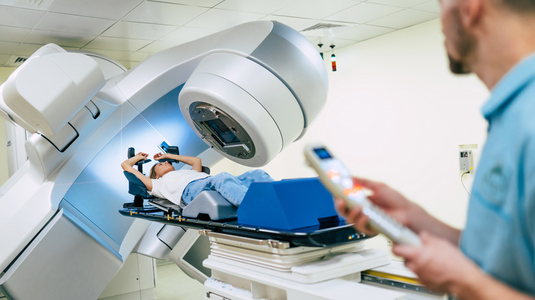 Woman undergoing radiation therapy