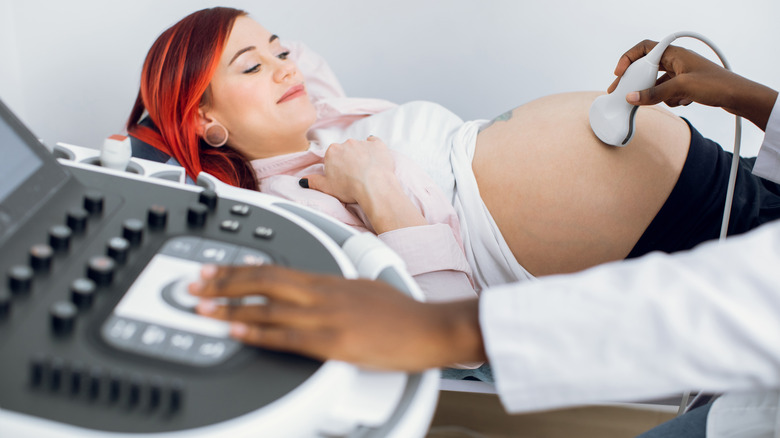 woman getting ultrasound during early pregnancy