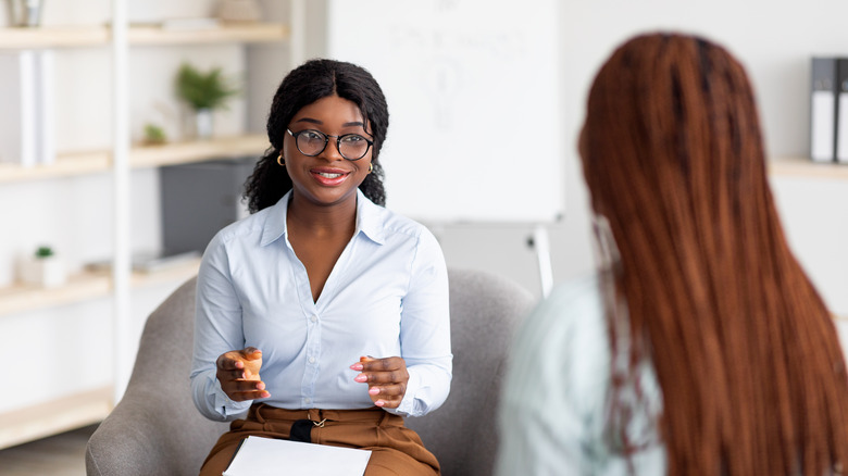 woman meeting with Black counselor 