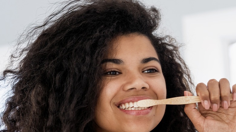 Woman brushing her teeth 