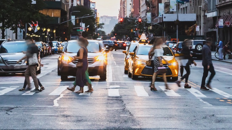 People crossing street in busy city