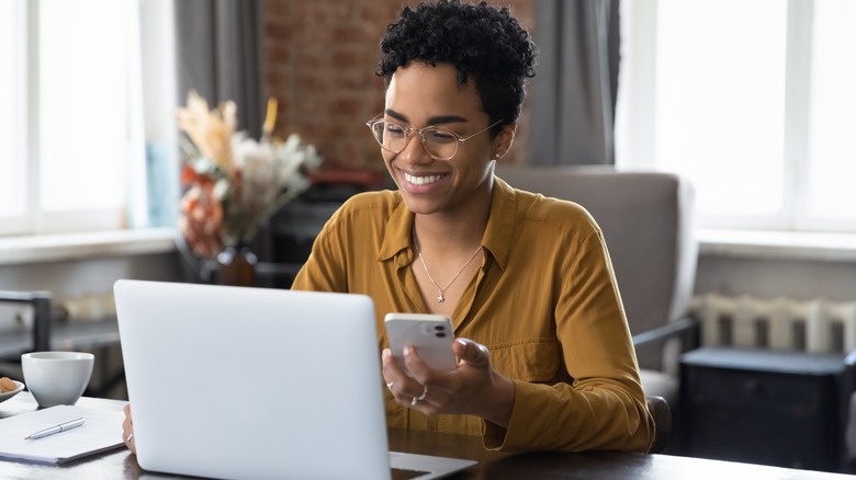 happy woman working on her computer