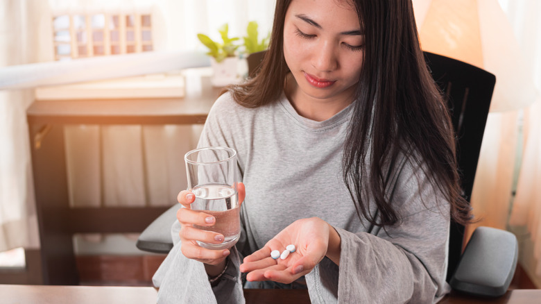 Woman taking medication