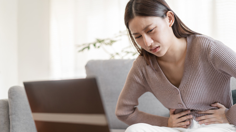 woman experiencing bloating