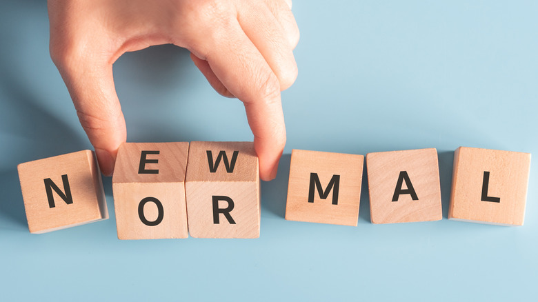 wooden blocks spelling 'new normal'