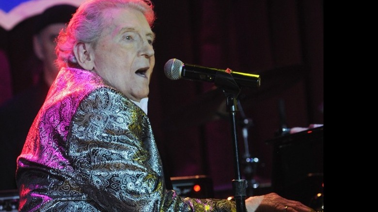 Jerry Lee Lewis plays the piano and sings 