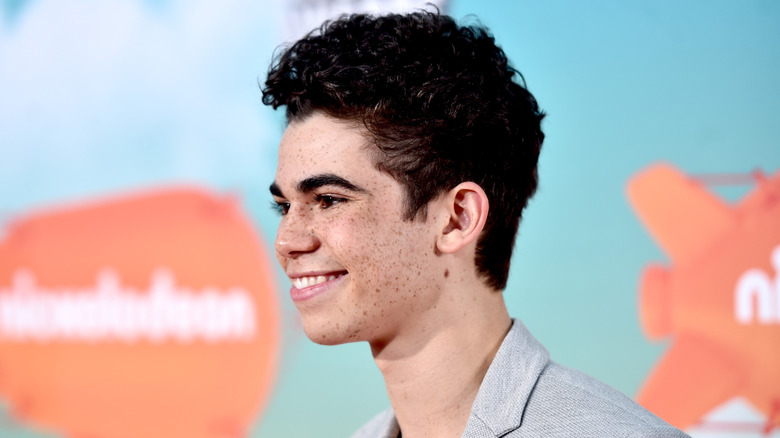 Smiling Cameron Boyce on red carpet