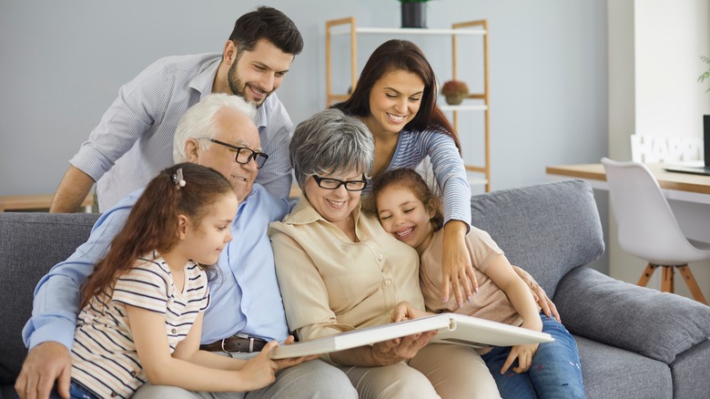 happy family looking at photos