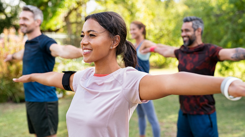 group of people exercising outdoors