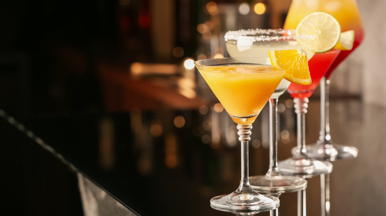 cocktails arranged neatly on bar