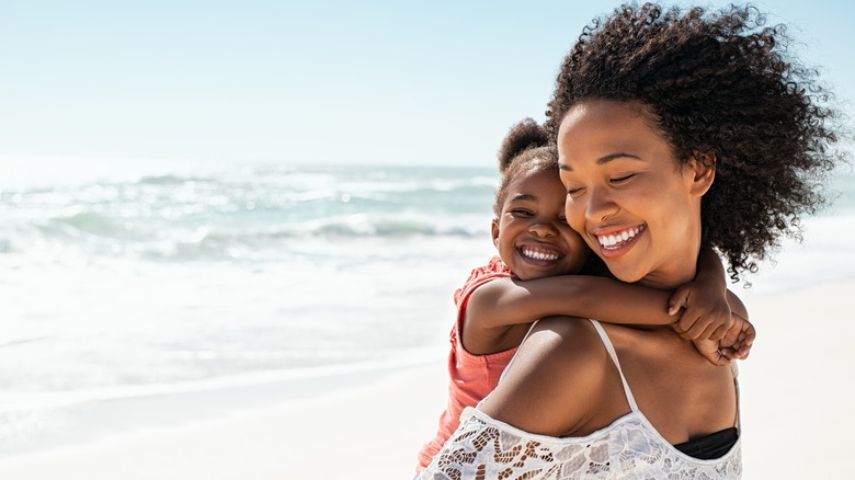 Parent and kid smiling 