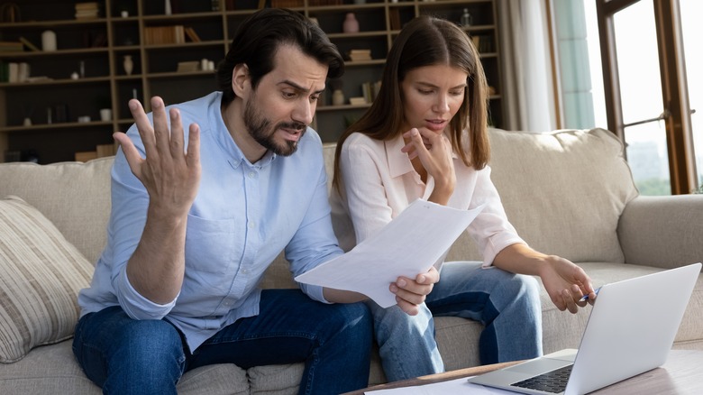 a couple conflicted over finances