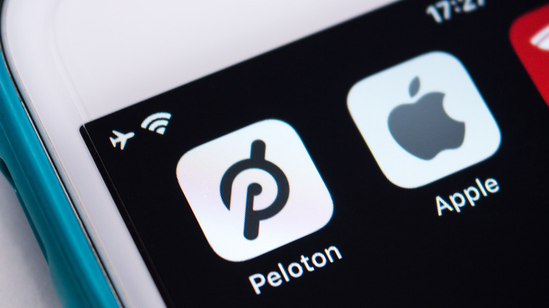 Peloton app next to Apple and Tesla