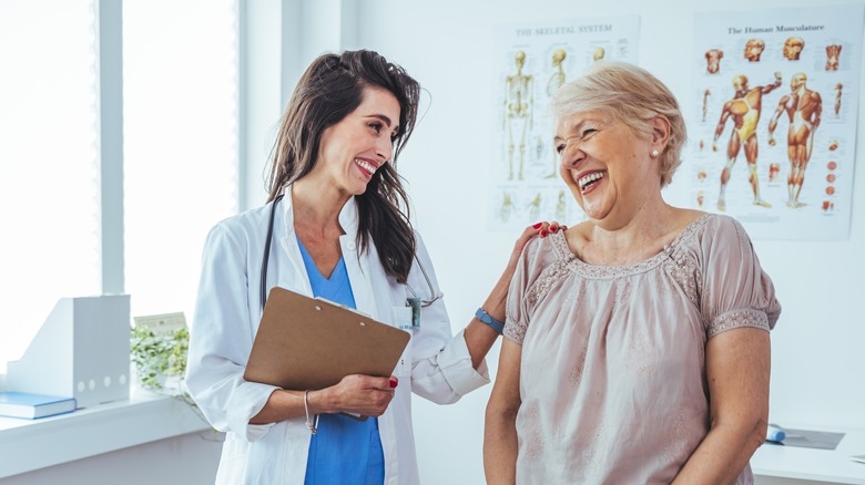 elderly female patient  speaking with young female doctor