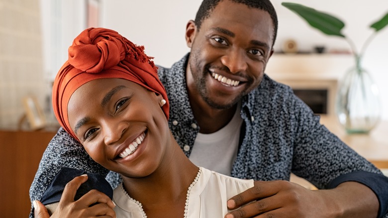 african american couple hugging