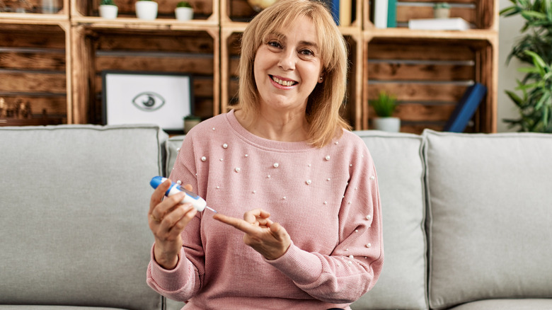 Older woman testing her blood sugar