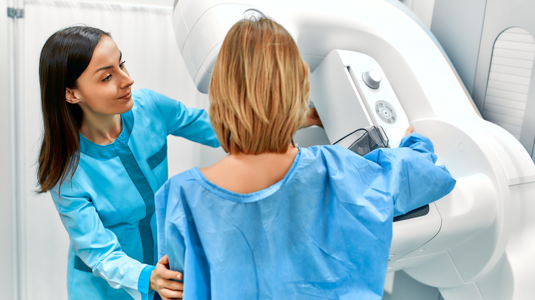 Doctor and woman during mammogram