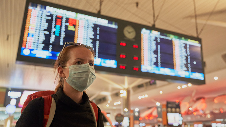 Woman wearing mask at airport