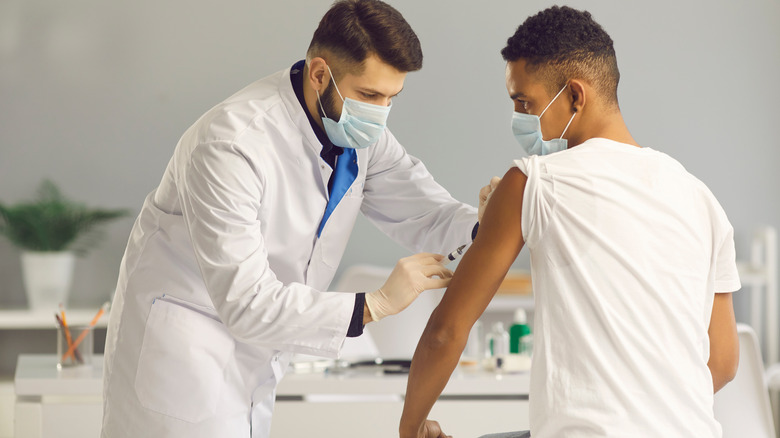 man getting vaccine