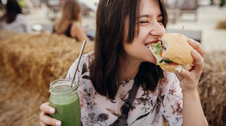 woman eating vegan burger