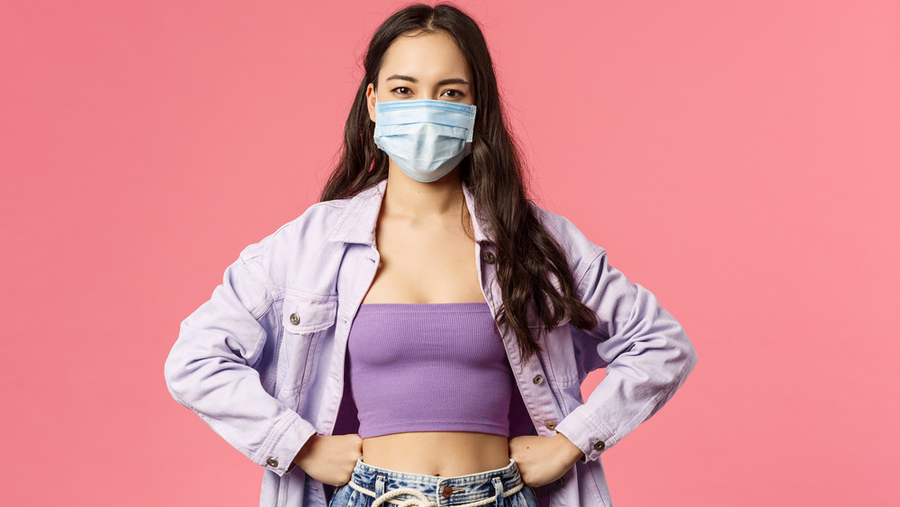 Woman wearing a face mask and looking at camera 