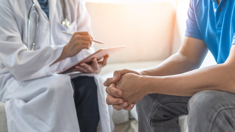 man at doctor exam