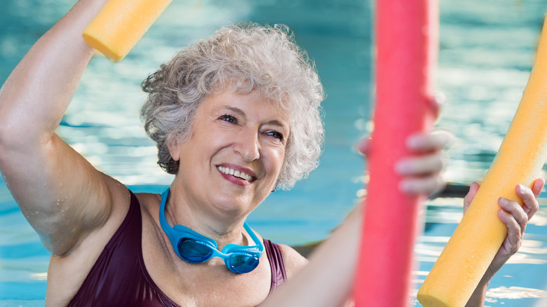 older woman doing aqua fitness