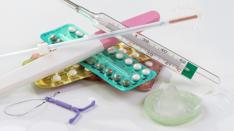 Various birth control methods on a table