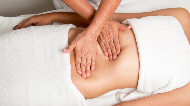 Woman getting an abdominal massage