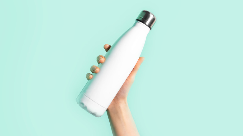 hand holding eco bottle