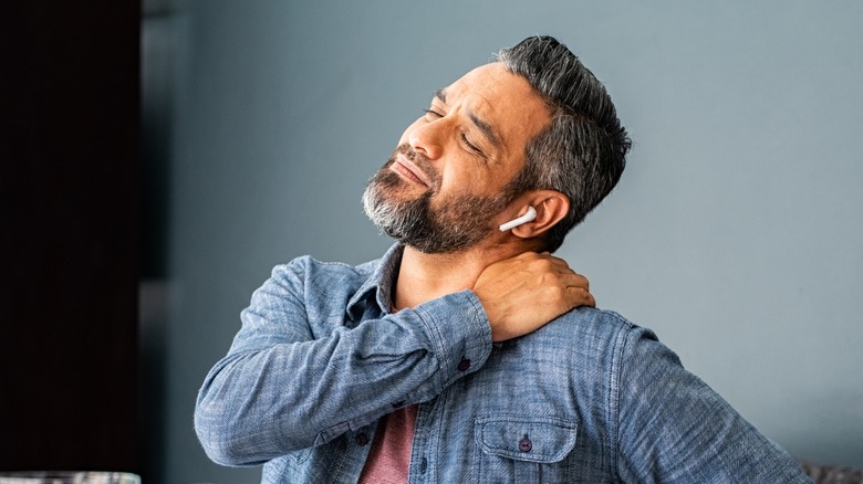 man stretching out neck