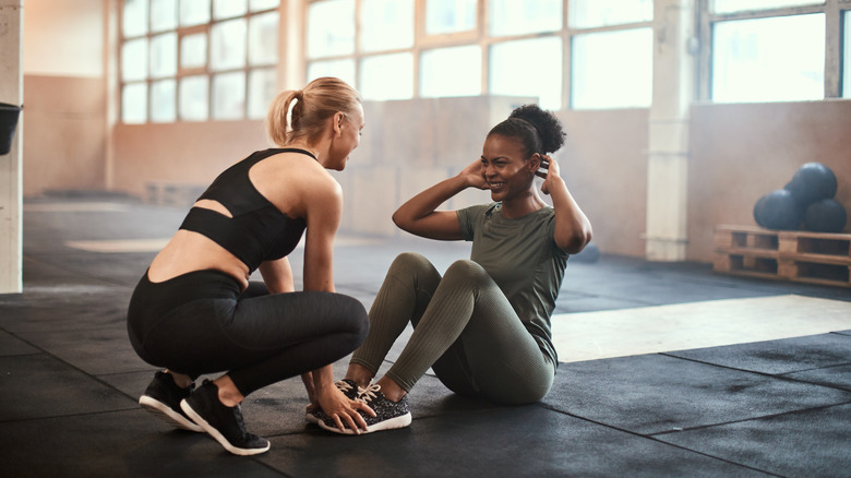 Two women are working out