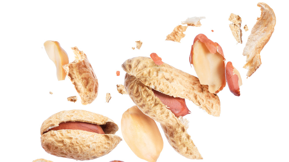 Crushed peanuts with a white background 