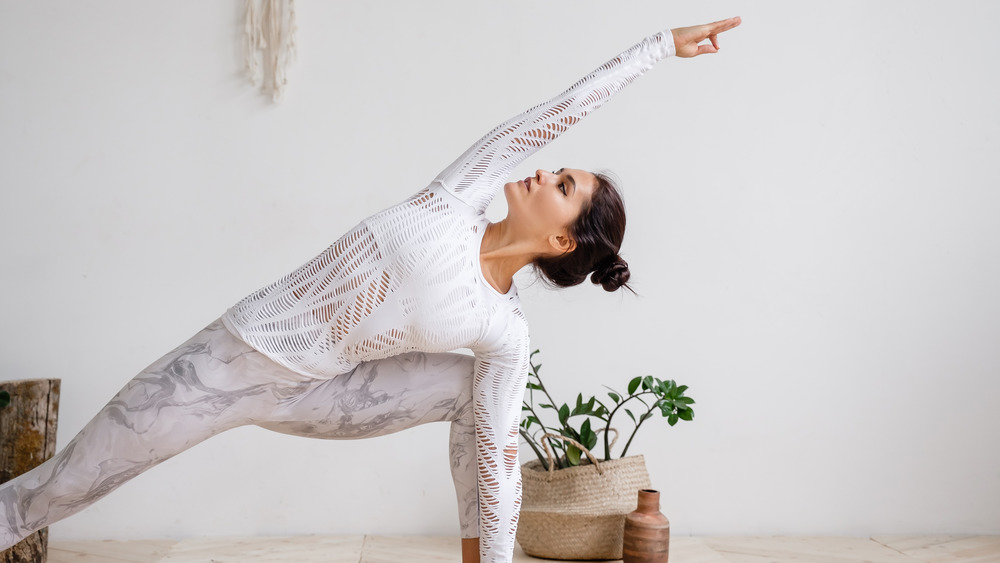 Woman doing yoga at home