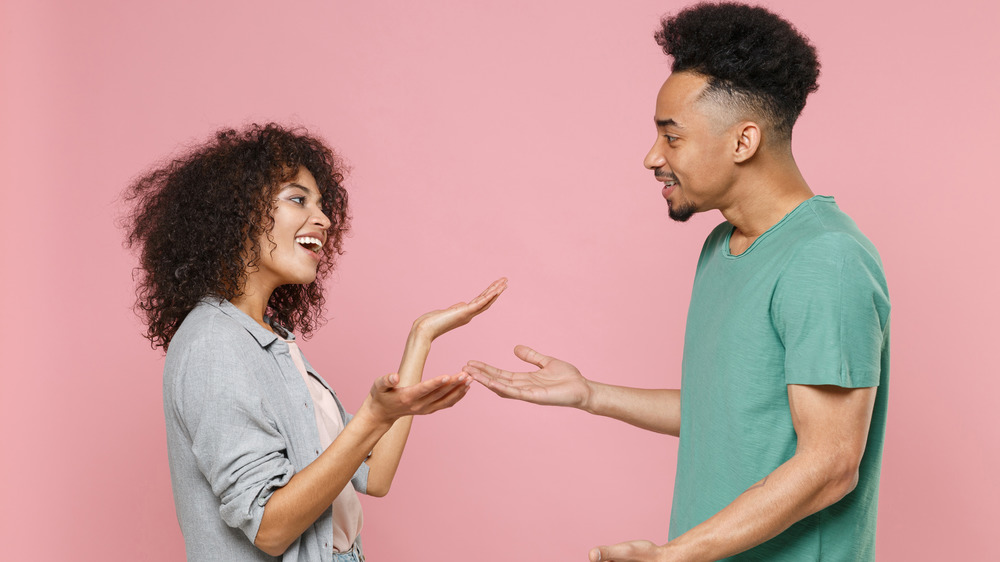 couple speaking with hands