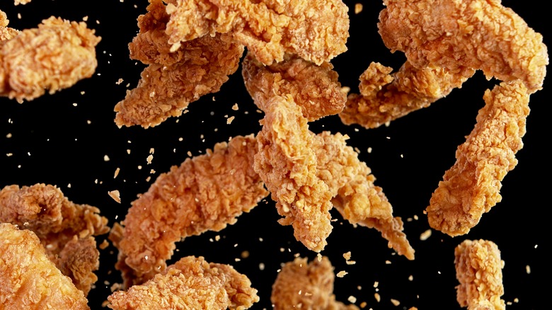 Freeze motion of flying fried chicken pieces