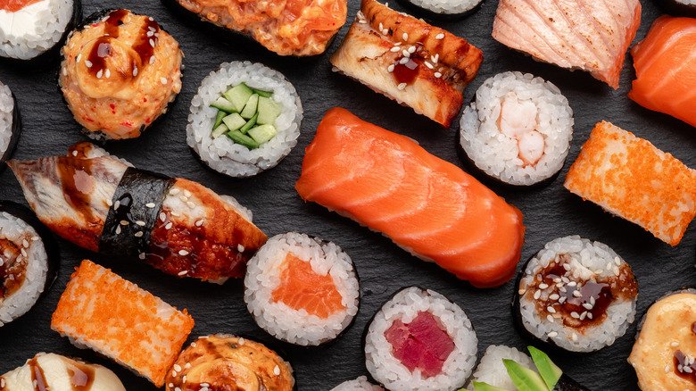 Overhead shot of assorted sushi on slate