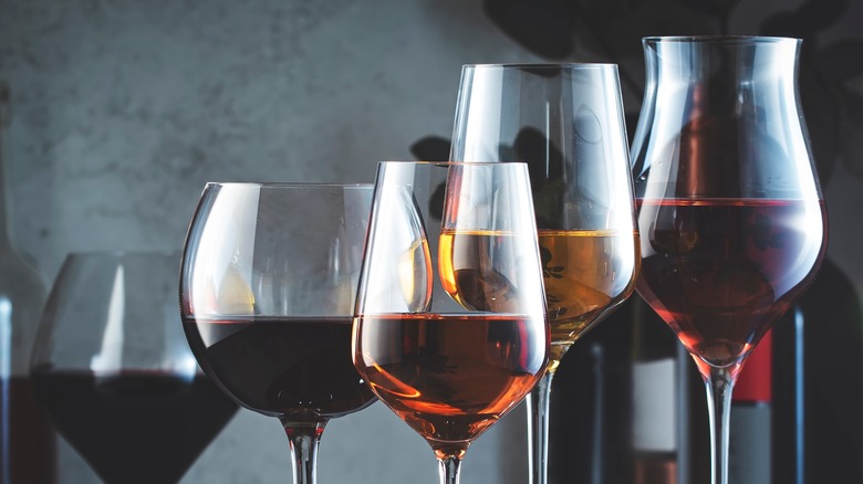 Wine glasses in front of wine bottles