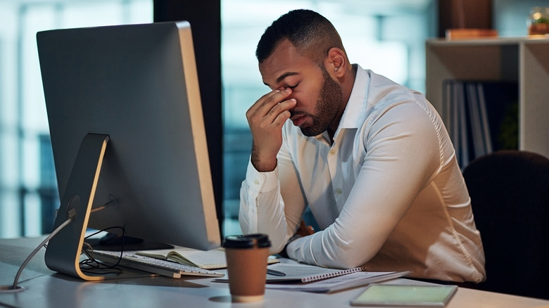 Stressed man working at desk