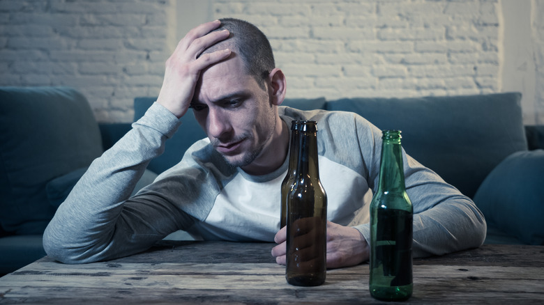 sad man with beer