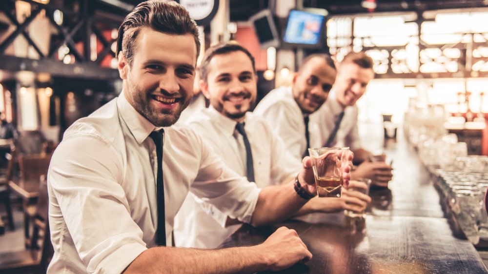 Businessmen drinking whiskey