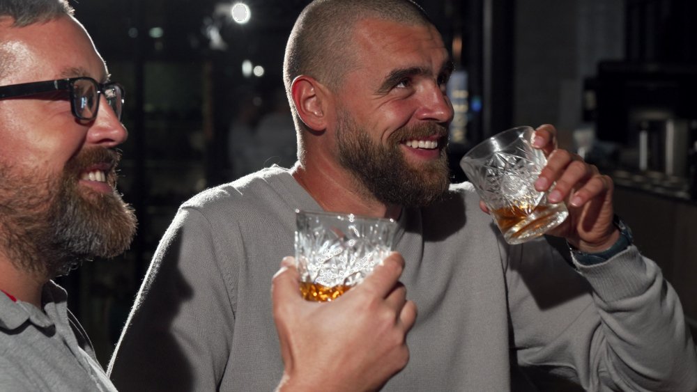 Athlete drinking whiskey