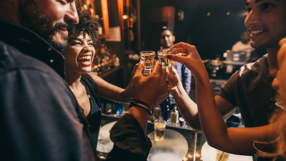 Friends having shots in a bar
