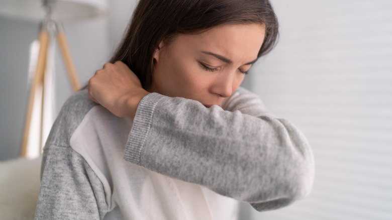 woman sneezing