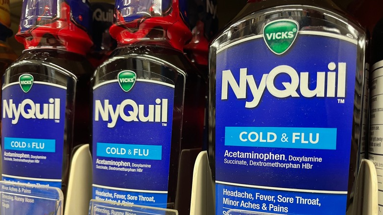 bottles of nyquil on store shelf 