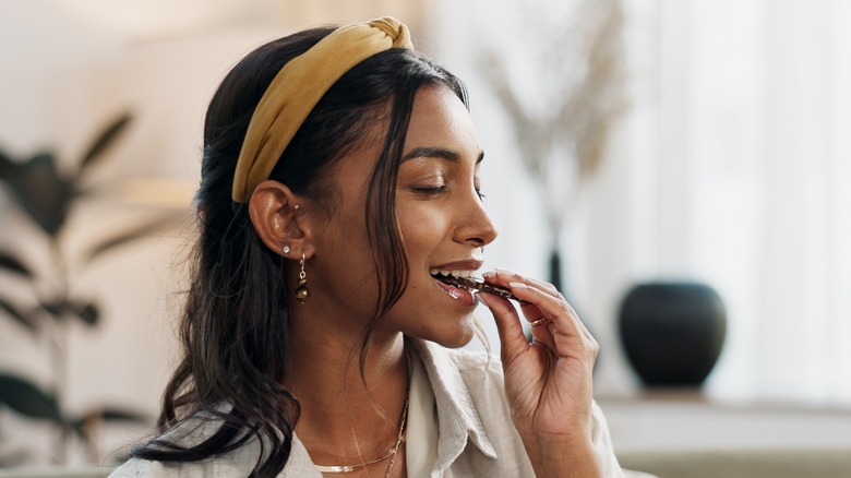 woman eating chocolate