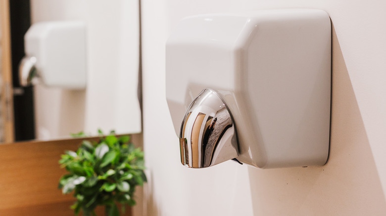 Electric hand dryer in restroom