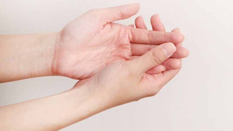 Pair of hands on white background