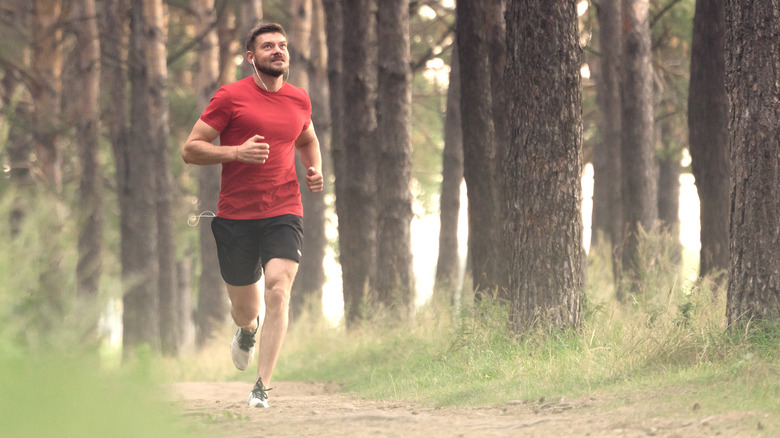 Man running in woods