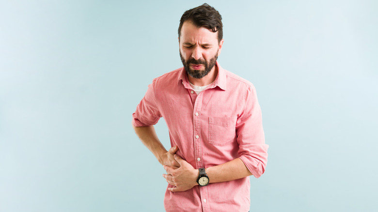 man holding stomach